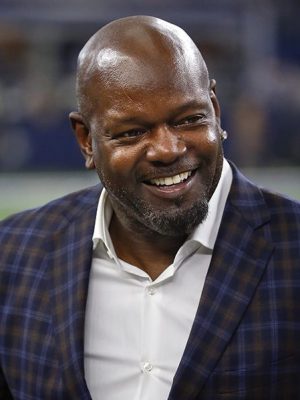 Former Dallas Cowboys running back Emmitt Smith looks on prior to action between the Seattle Seahawks and Dallas Cowboys during a NFL football game on Sunday, Nov. 1, 2015 in Arlington, Texas. The Seahawks won the game, 13-12. (G. Newman Lowrance via AP)